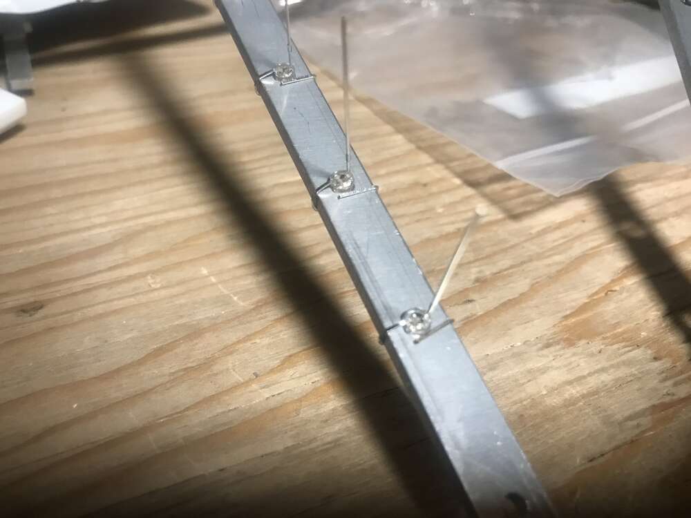 Close up of the ground lead of an LED wrapping around PyroFox's all metal fan frame